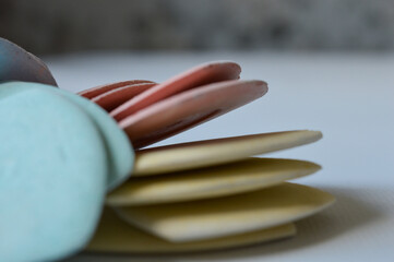colorful tailor's chalks neatly arranged in a cardboard box, ideal for sewing, dressmaking, or...