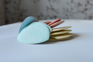 colorful tailor's chalks neatly arranged in a cardboard box, ideal for sewing, dressmaking, or...