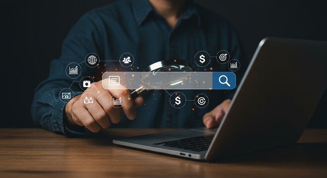 Person using laptop with search bar and magnifying glass overlay for online data analysis concept