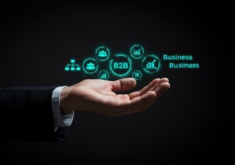 Businessman s outstretched hand displaying a glowing network of business icons and the words business to business
