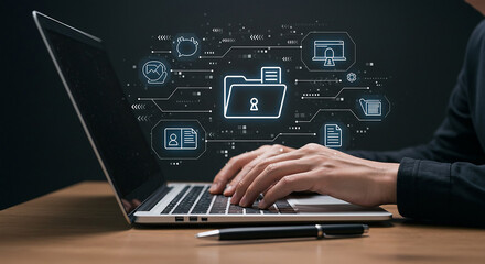Person typing on laptop with digital data security icons hovering above the keyboard on a desk