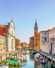 Chioggia town in Venetian Lagoon, canal and church. Veneto, Italy