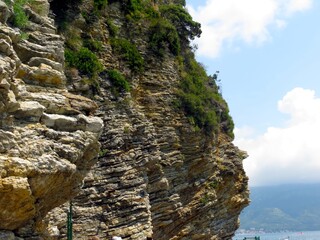 Stunning Rock Formations Along the Coastline of Montenegro Under a Clear Sky