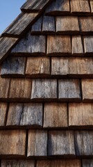 Rustic wooden shingles roof close-up in vertical composition.