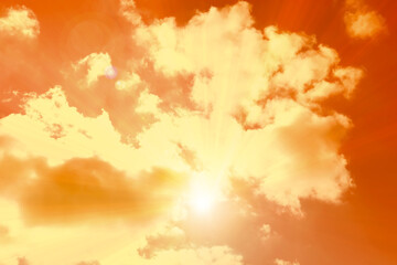 Orange sky with clouds during hot summer weather