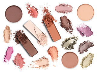 Crushed eyeshadows and refill pans on white background, set. Bright palette