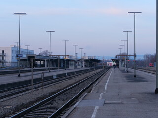 Train station with a few trains parked on the tracks