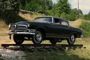 Black old car on rails