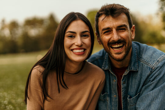 Happy couple smiling and having fun outdoors in nature