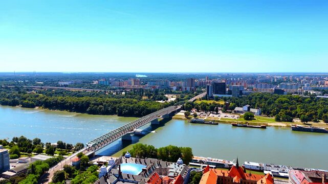 The Old Bridge connecting the banks of Bratislava, Slovakia. Drone footage over the historical part of the beautiful city.