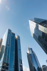 Naklejka premium Modern Skyscrapers and High-Rise Buildings Under Clear Blue Sky