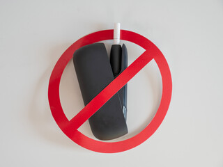 Prohibition sign on an electronic cigarette. Tobacco heating system. 