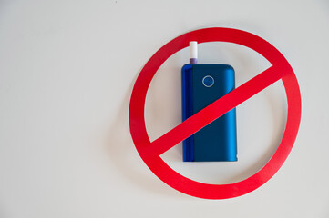 Prohibition sign on an electronic cigarette. Tobacco heating system. 