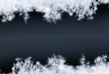 Frame of snowflakes creating a border on a black background, perfect for winter and christmas themes