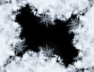 Frame of snowflakes creating a border on a black background, perfect for winter and christmas themes
