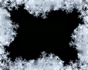 Frame of snowflakes creating a border on a black background, perfect for winter and christmas themes