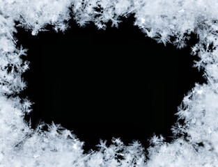Frame of snowflakes creating a border on a black background, perfect for winter and christmas themes