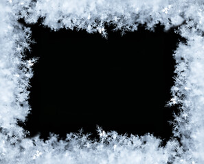 Frame of snowflakes creating a border on a black background, perfect for winter and christmas themes