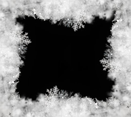 Frame of snowflakes creating a border on a black background, perfect for winter and christmas themes