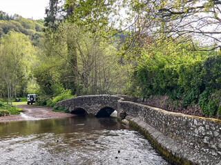 Dunster UK, March 15, 2025. The Gallox Bridge in Dunster, Somerset, England dates from the 15th century. with two arches over the River Avill. It was originally known as Gallows Bridge