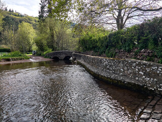 Dunster UK, March 15, 2025. The Gallox Bridge in Dunster, Somerset, England dates from the 15th century. with two arches over the River Avill. It was originally known as Gallows Bridge