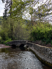 Dunster UK, March 15, 2025. The Gallox Bridge in Dunster, Somerset, England dates from the 15th century. with two arches over the River Avill. It was originally known as Gallows Bridge