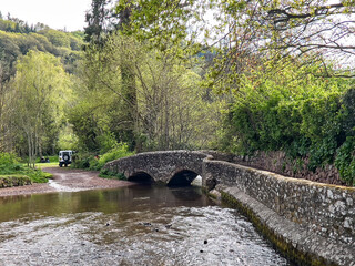 Dunster UK, March 15, 2025. The Gallox Bridge in Dunster, Somerset, England dates from the 15th century. with two arches over the River Avill. It was originally known as Gallows Bridge