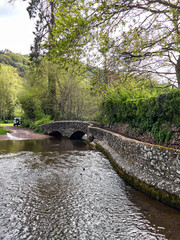 Dunster UK, March 15, 2025. The Gallox Bridge in Dunster, Somerset, England dates from the 15th century. with two arches over the River Avill. It was originally known as Gallows Bridge