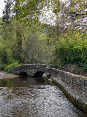 Dunster UK, March 15, 2025. The Gallox Bridge in Dunster, Somerset, England dates from the 15th century. with two arches over the River Avill. It was originally known as Gallows Bridge