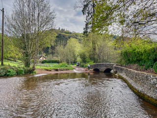 Dunster UK, March 15, 2025. The Gallox Bridge in Dunster, Somerset, England dates from the 15th century. with two arches over the River Avill. It was originally known as Gallows Bridge