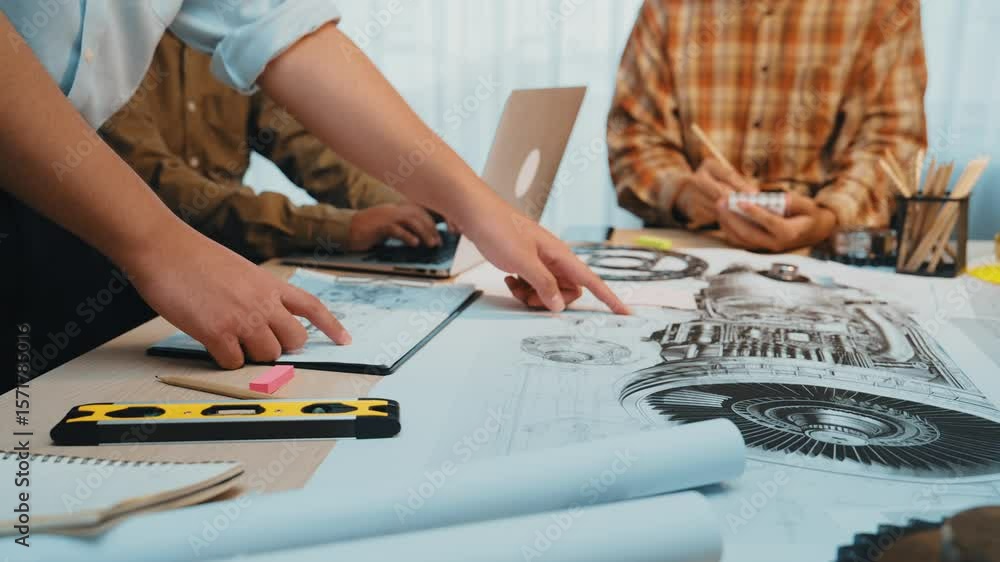 Poster a dynamic scene in a creative workspace highlighting hands engaged in sketching and planning, showca