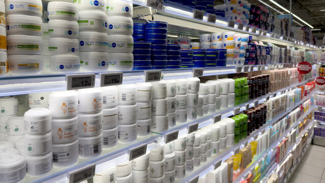 Warsaw, Poland - June 28, 2025: Shelves filled with various skincare products in a retail store display
