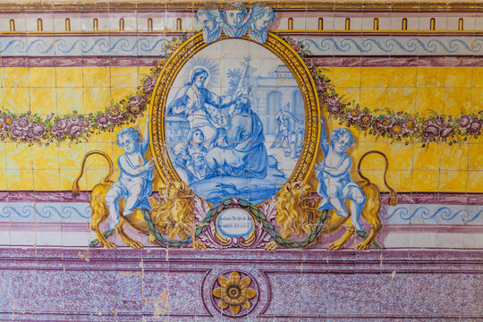 Stone relief carving featuring two winged angelic figures holding a scroll inscribed with the year 1730