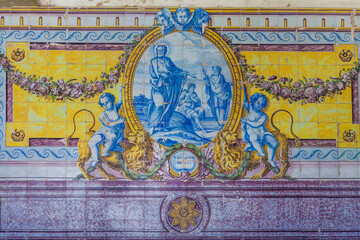 a large, ornate Portuguese azulejo tile panel featuring a central religious scene in blue and white