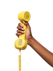 A hand holding a yellow vintage telephone isolated on transparent background