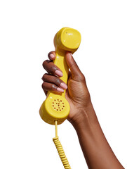 A hand holds a vintage yellow telephone receiver isolated on transparent background
