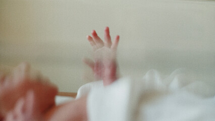 hands of the newborn baby in hospital