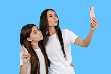 Selfie with mother and daughter. Capture the moment, cherish the memory. Portrait together with...