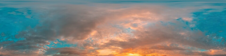 Sunset sky panorama with bright glowing pink Cumulus clouds. HDR 360 seamless spherical panorama....