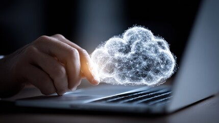 Hand interacting with a digital cloud over a laptop