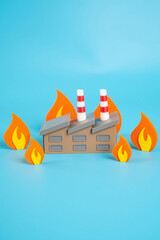 The factory building is engulfed in flames. Concept of problems and serious crisis in industry....