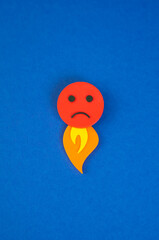 An evil face with a flame of fire coming out from below. The concept of rage and uncontrollable...