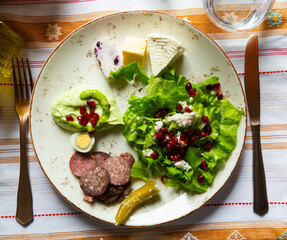 Albanian appetizers of salad, jatrash mixture and salke kosi. High quality photo