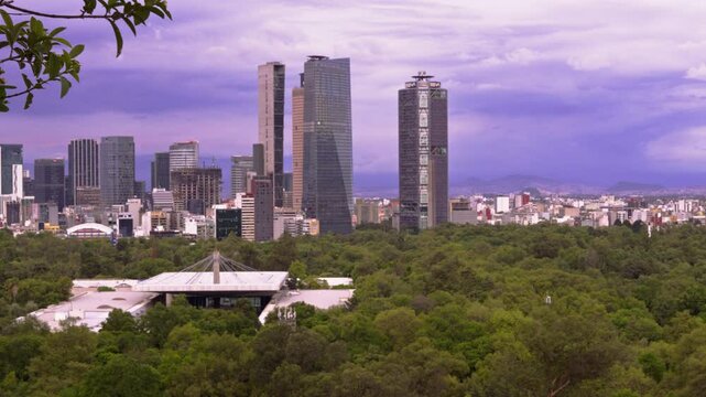 Wide panoramic shot of Mexico City's Chapultepec Forest and Chapultepec Castle with the urban skyline in the background 
