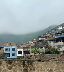 Hillside Homes in Mist — Urban Density in Foggy Landscape