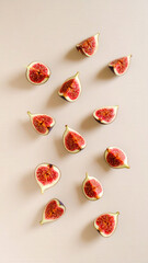 Fototapeta premium Sliced figs levitating in layered composition with exposed seeds and rich texture — floating fruit slices on clean background for elegant food visuals