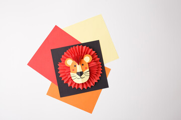 Lion paper craft on white background for kids magazine layouts, early learning resources, art...