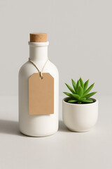 Minimalist bottle with kraft tag and succulent decor on neutral background