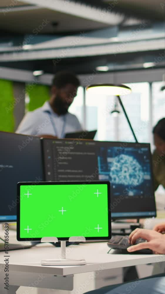 Poster vertical video technician developing applications using chroma key tablet, integrating ai next to of