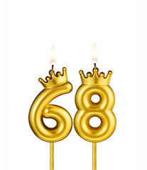 Golden number 68 birthday candle on white background